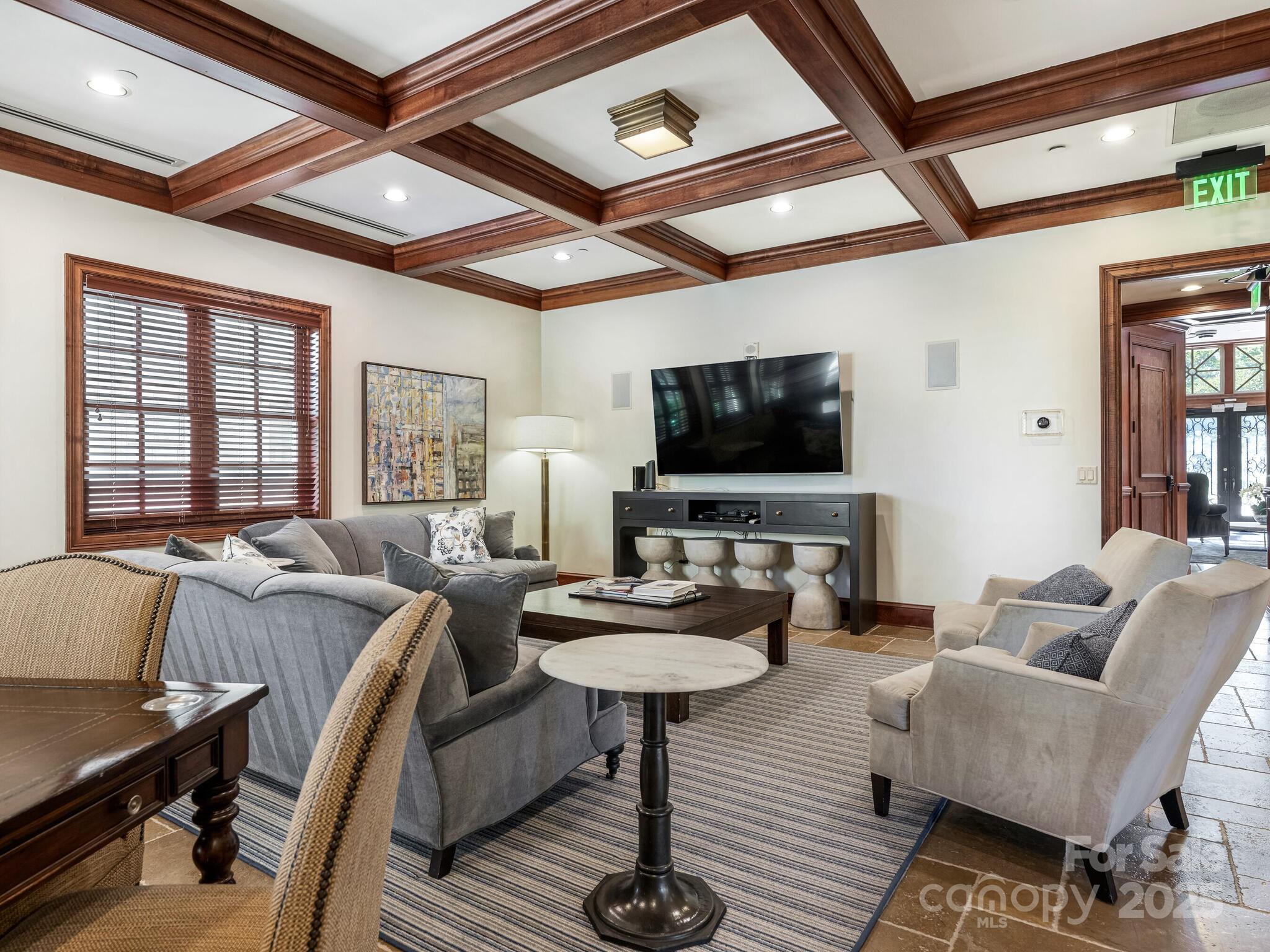 2823 Providence Road, Unit 152 Charlotte, NC 28211 - Photo 34 of 41 a living room with furniture and a flat screen tv
