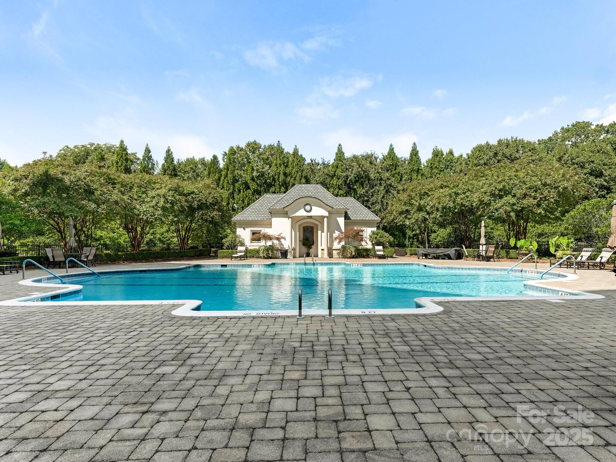 2823 Providence Road, Unit 152 Charlotte, NC 28211 - Photo 37 of 41 a view of swimming pool and trees in the background