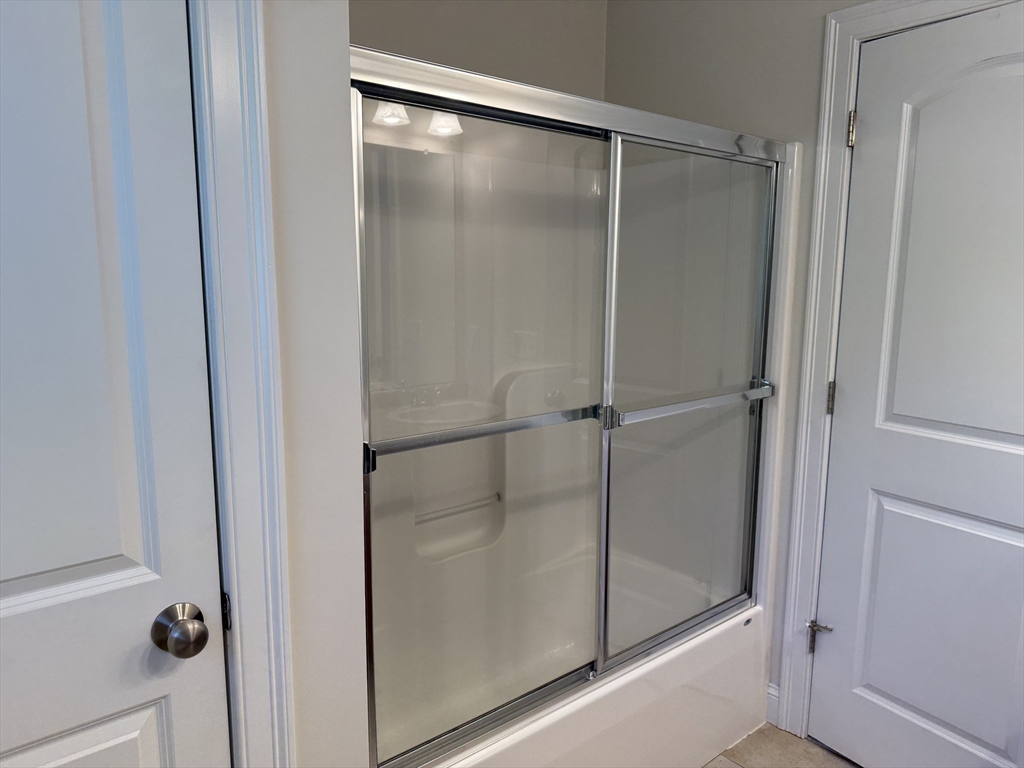 87 Center Street Carver, MA 02330 - Photo 21 of 42 a bathroom with a glass shower door