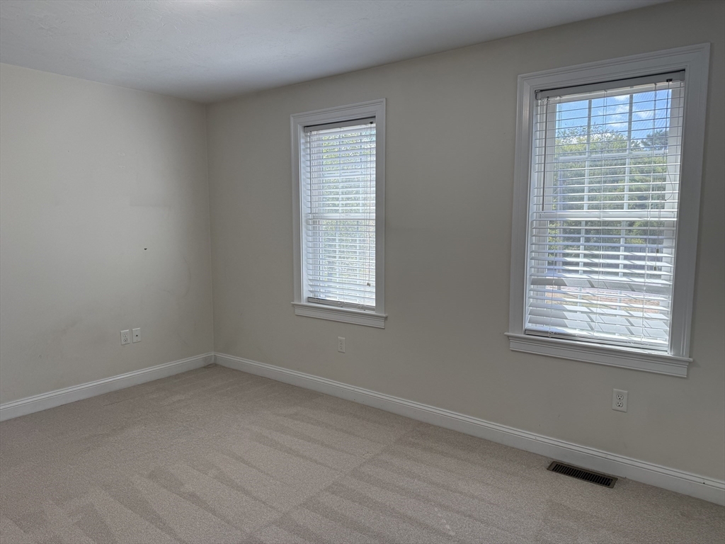 87 Center Street Carver, MA 02330 - Photo 25 of 42 an empty room with a window