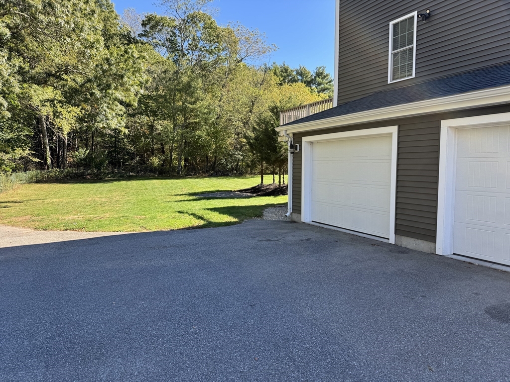 87 Center Street Carver, MA 02330 - Photo 38 of 42 a view of a house with a yard and a large tree