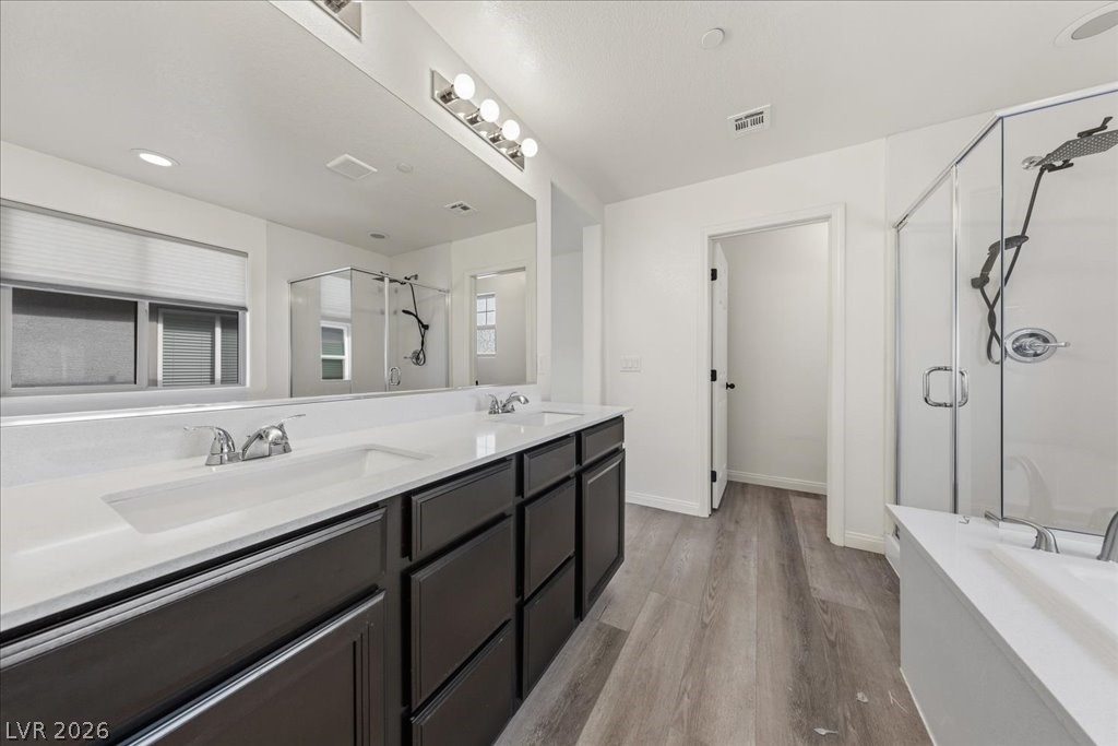 290 Cape Seville Place Henderson, NV 89015 - Photo 19 of 50 Double vanities, lots of cabinet space and separate tube and walk-in shower.