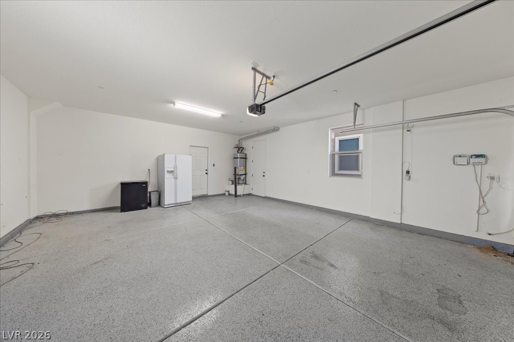 290 Cape Seville Place Henderson, NV 89015 - Photo 31 of 50 Finished two car garage with epoxy floors, extra refrigerator and freezer and auto garage door opener.