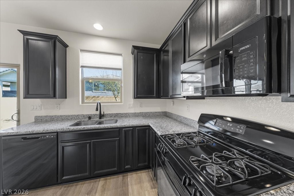 290 Cape Seville Place Henderson, NV 89015 - Photo 10 of 50 Deluxe kitchen with an abundance of Shaker cabinets, granite counters and upgraded stainless steel appliances.