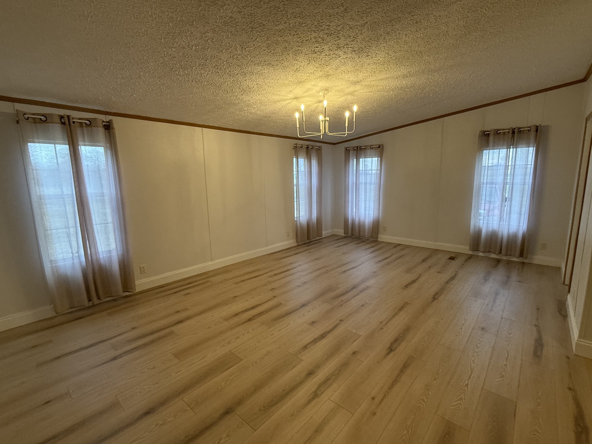 621 Cook Road Portland, TN 37148 - Photo 11 of 55 an empty room with wooden floor and windows