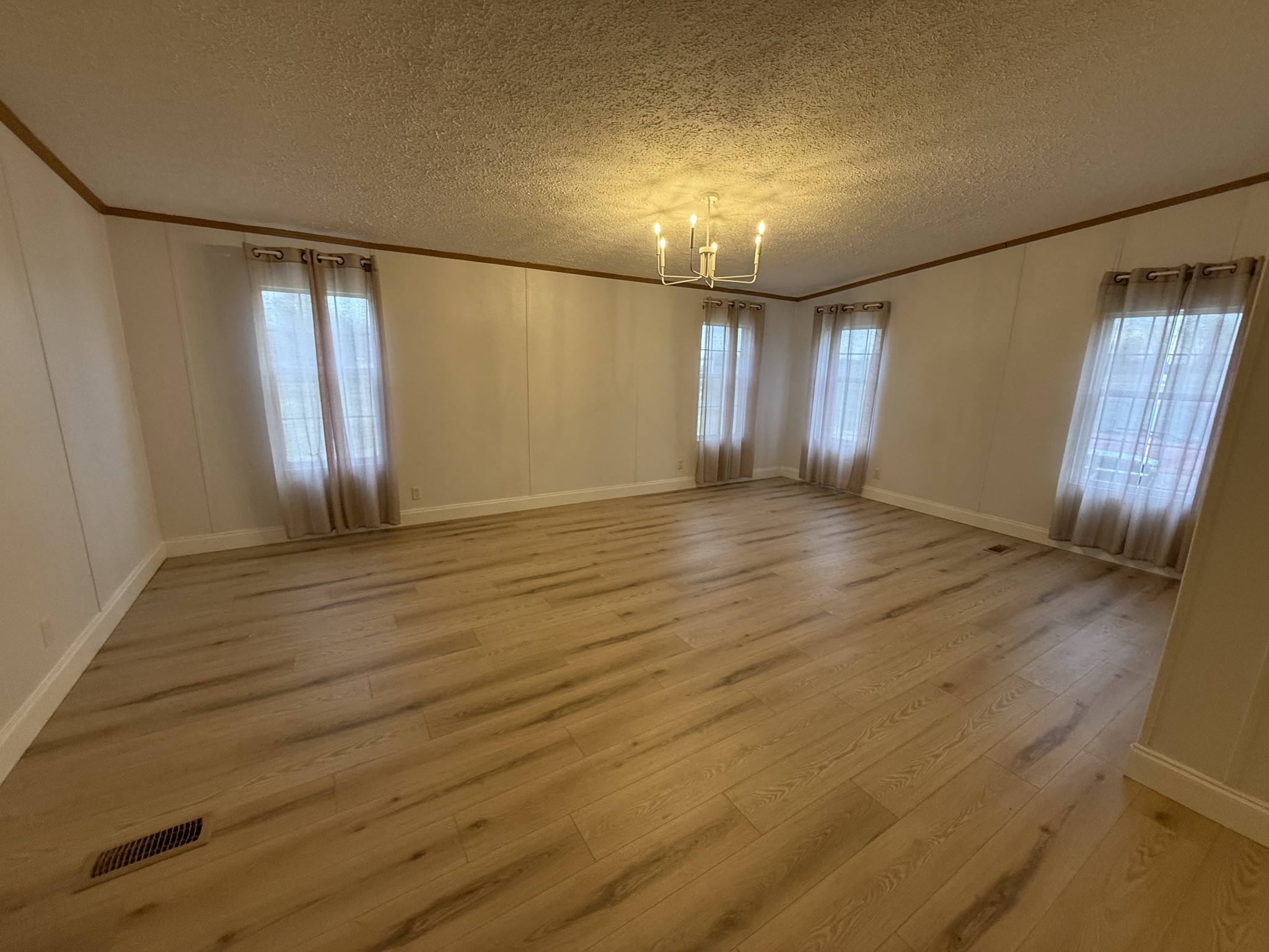621 Cook Road Portland, TN 37148 - Photo 13 of 55 an empty room with wooden floor and windows