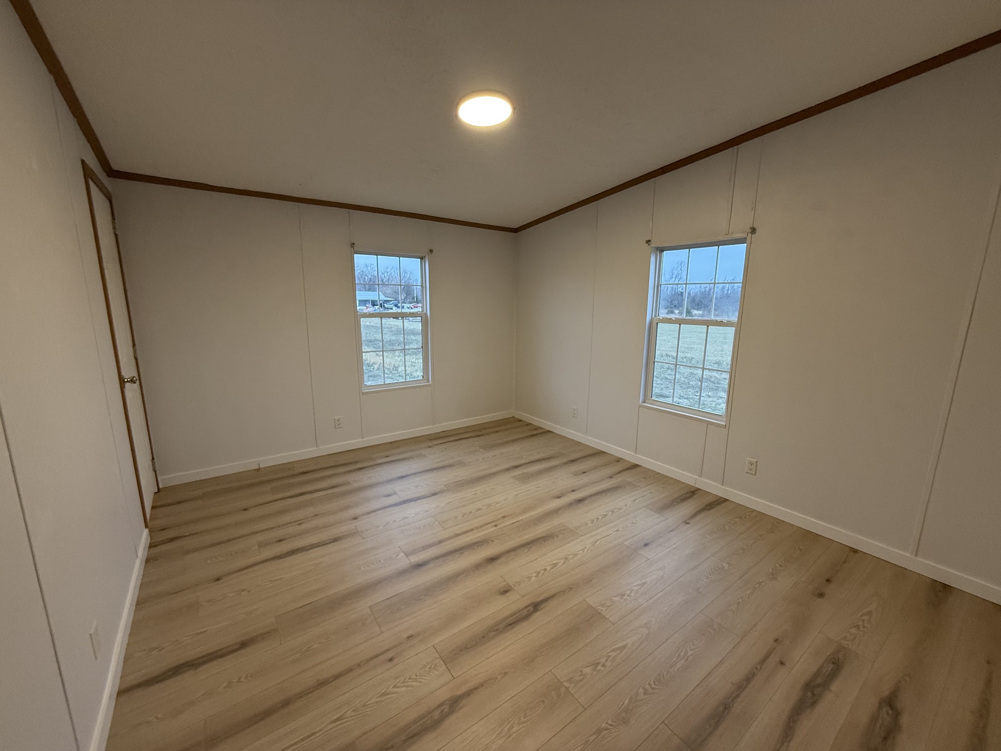 621 Cook Road Portland, TN 37148 - Photo 30 of 55 an empty room with wooden floor and windows