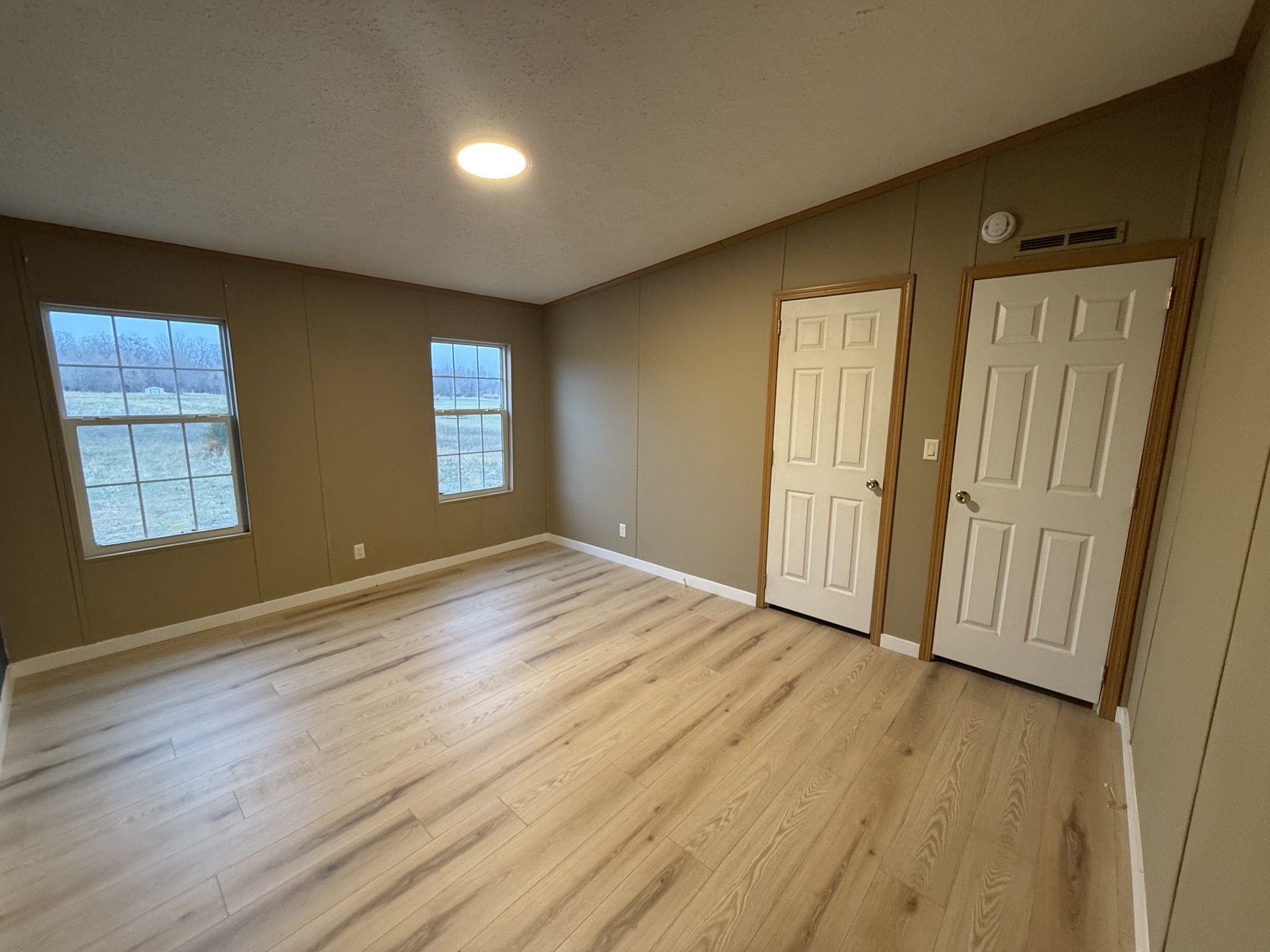 621 Cook Road Portland, TN 37148 - Photo 41 of 55 an empty room with wooden floor and windows