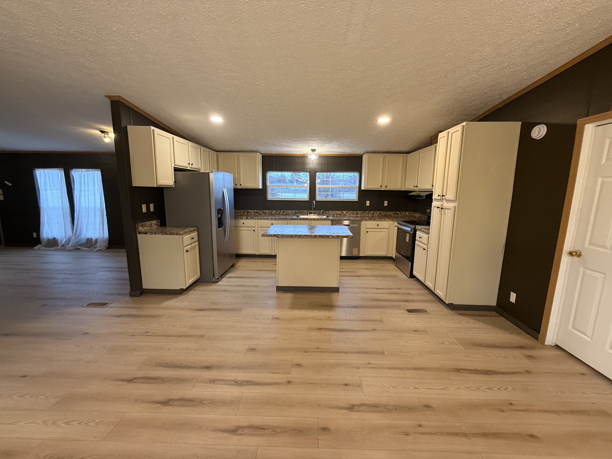 621 Cook Road Portland, TN 37148 - Photo 7 of 55 a view of kitchen with refrigerator stove and wooden cabinets