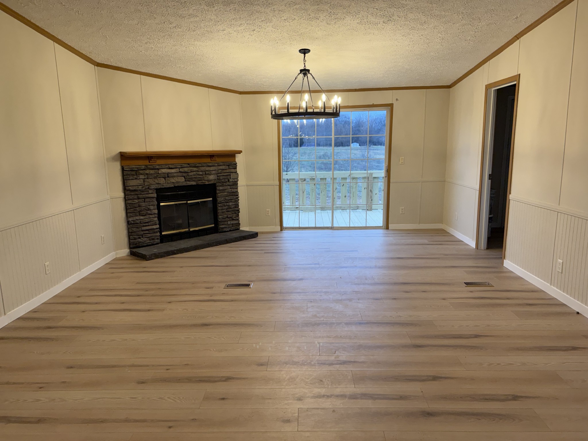621 Cook Road Portland, TN 37148 - Photo 10 of 55 a view of a livingroom with wooden floor a fireplace and window