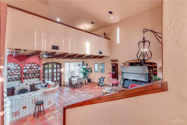 a view of a dining room with furniture and a potted plant