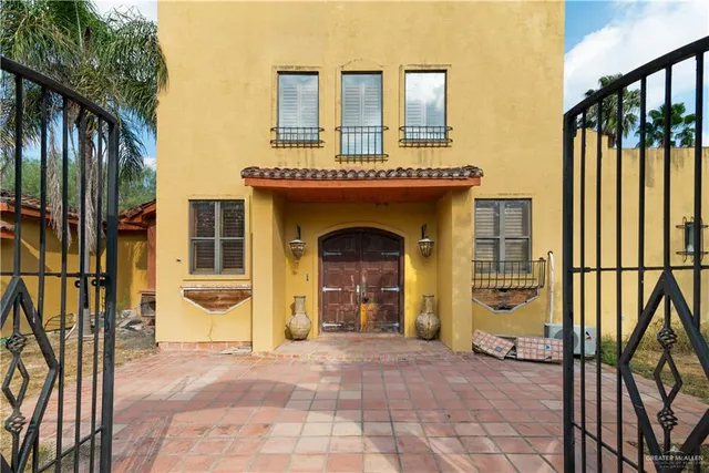 a view of a house with wooden floor and fence
