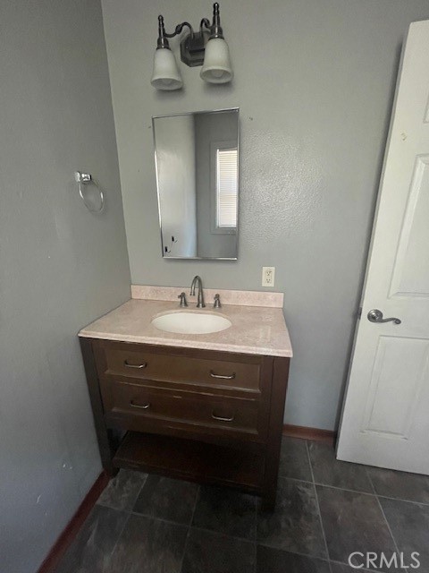 172 North 13th Street Grover Beach, CA 93433 - Photo 12 of 21 a bathroom with a sink vanity and a mirror