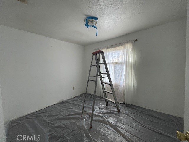 172 North 13th Street Grover Beach, CA 93433 - Photo 17 of 21 an empty room with wooden floor and a window