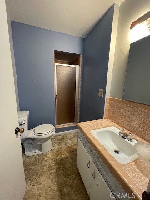 172 North 13th Street Grover Beach, CA 93433 - Photo 19 of 21 a bathroom with a sink toilet and shower