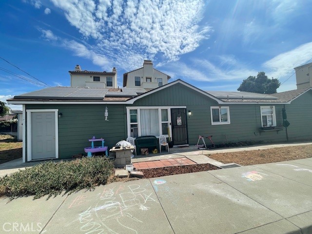 172 North 13th Street Grover Beach, CA 93433 - Photo 2 of 21 a front view of a house with garden