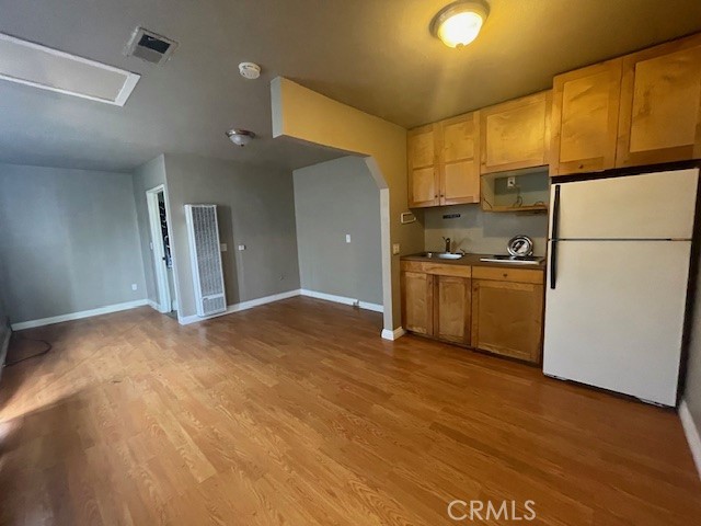 172 North 13th Street Grover Beach, CA 93433 - Photo 7 of 21 a view of a kitchen with a sink and a refrigerator