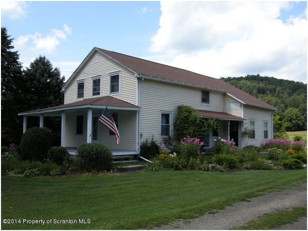 a front view of house with garden