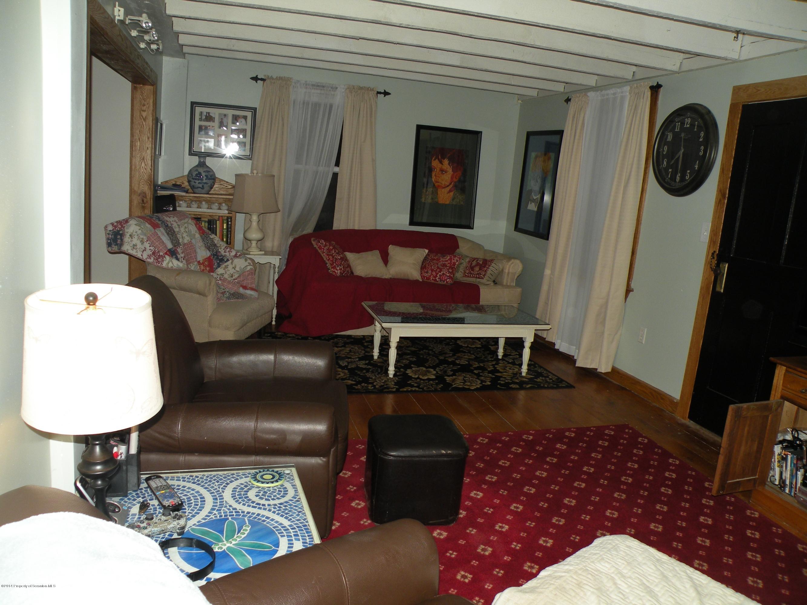 611 Highway 467 Rome, PA 18837 - Photo 17 of 45 a living room with furniture and a window
