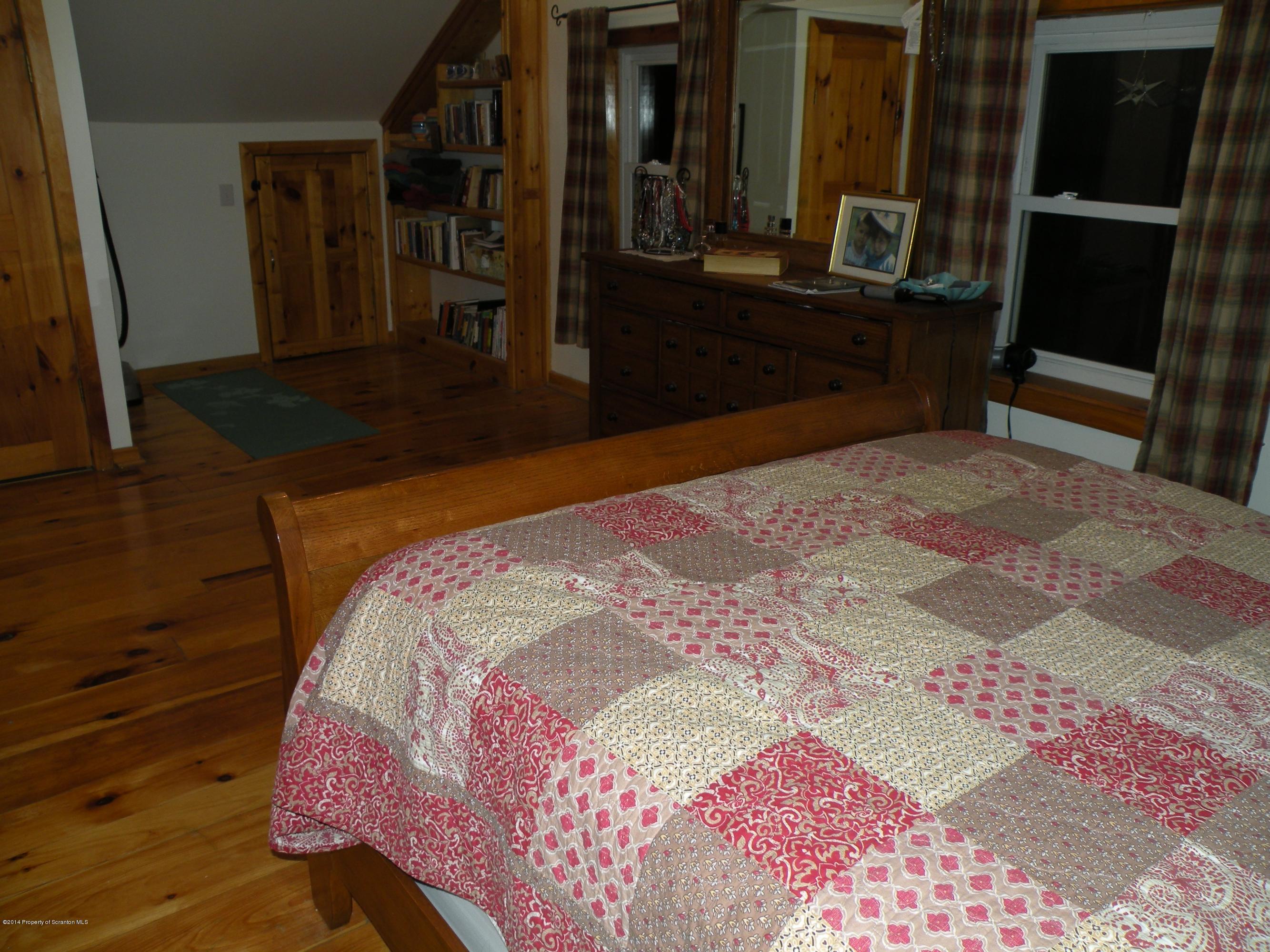 611 Highway 467 Rome, PA 18837 - Photo 35 of 45 a bedroom with a bed and a mirror