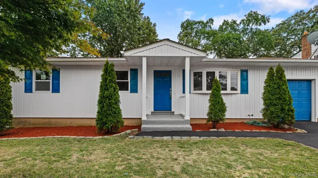 front view of a house with a yard