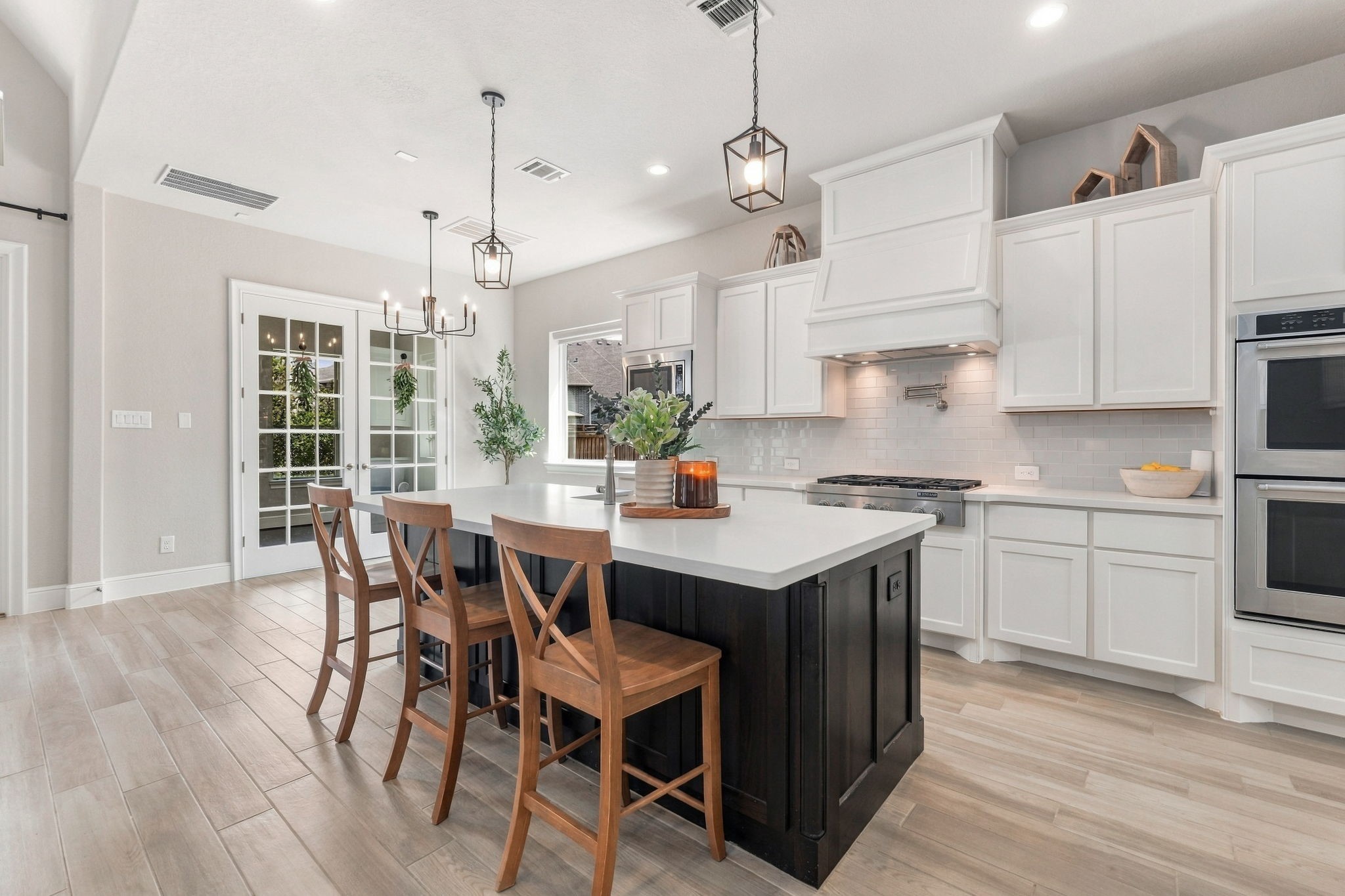 26910 Selinsgrove Road Magnolia, TX 77354 - Photo 17 of 47 The gas cooktop anchors a beautifully finished cooking station.The pot filler is a practical upgrade positioned exactly where you want it.