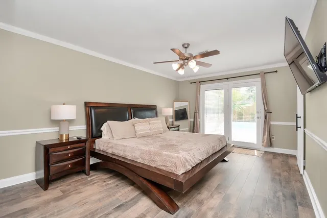 a bathroom with a sink a toilet a mirror and shower