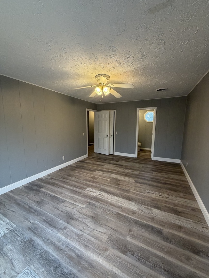 2 Hickory Lane Metropolis, IL 62960 - Photo 18 of 20 an empty room with wooden floor and windows