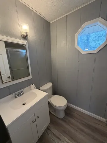 a bathroom with a glass shower door