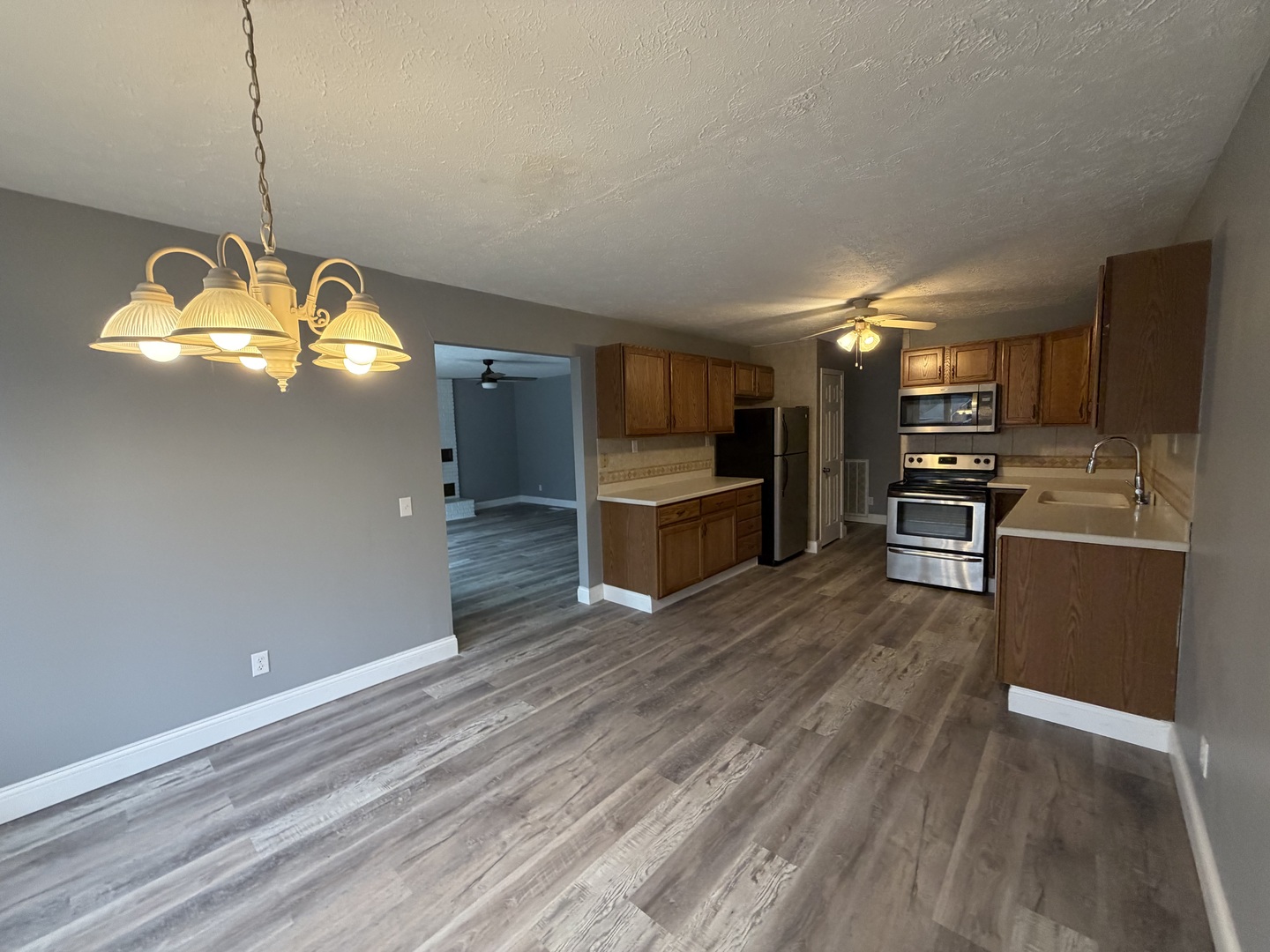 2 Hickory Lane Metropolis, IL 62960 - Photo 6 of 20 a kitchen with stainless steel appliances granite countertop a stove and wooden floor