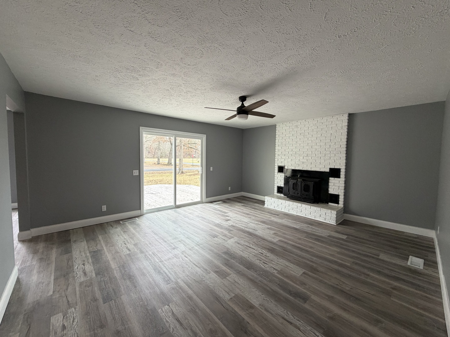2 Hickory Lane Metropolis, IL 62960 - Photo 7 of 20 a view of empty room with wooden floor and fan