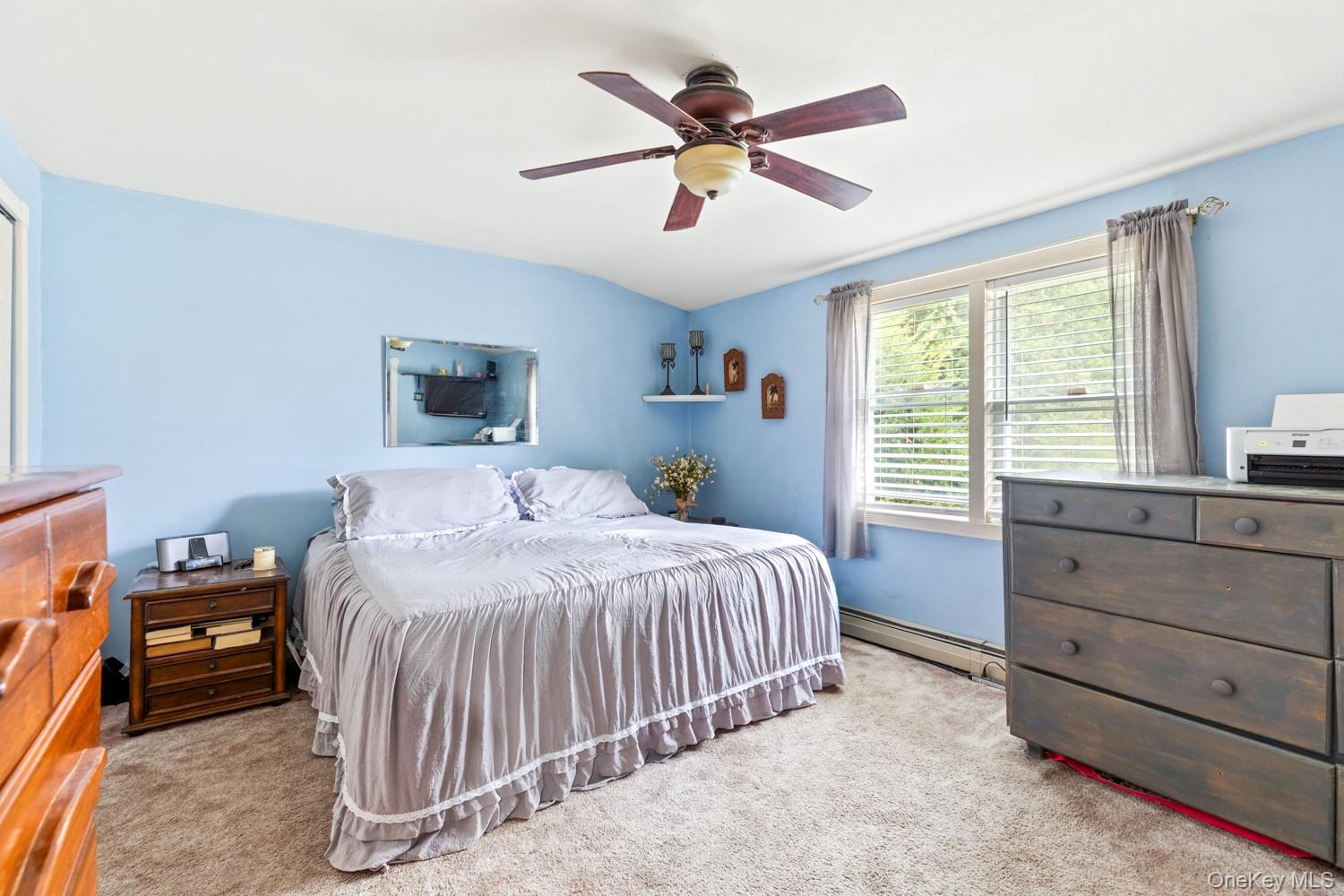 14 Comus Road Rocky Point, NY 11778 - Photo 17 of 23 a bedroom with a bed and a window