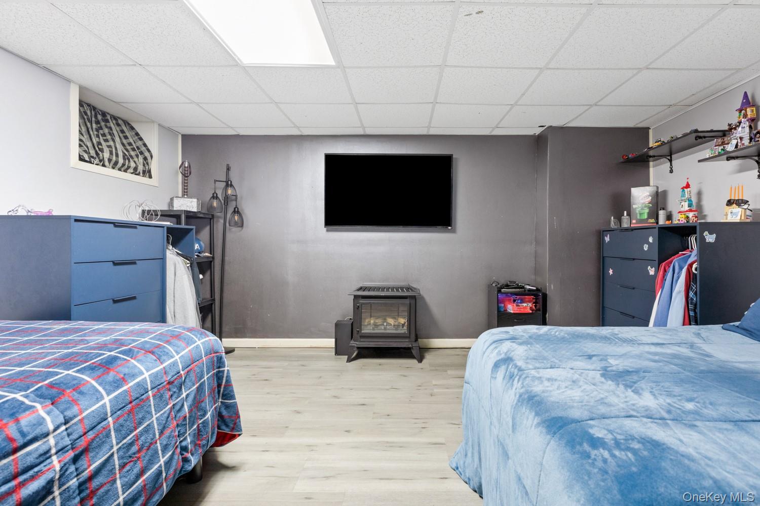 14 Comus Road Rocky Point, NY 11778 - Photo 20 of 23 a bedroom with a bed and a television