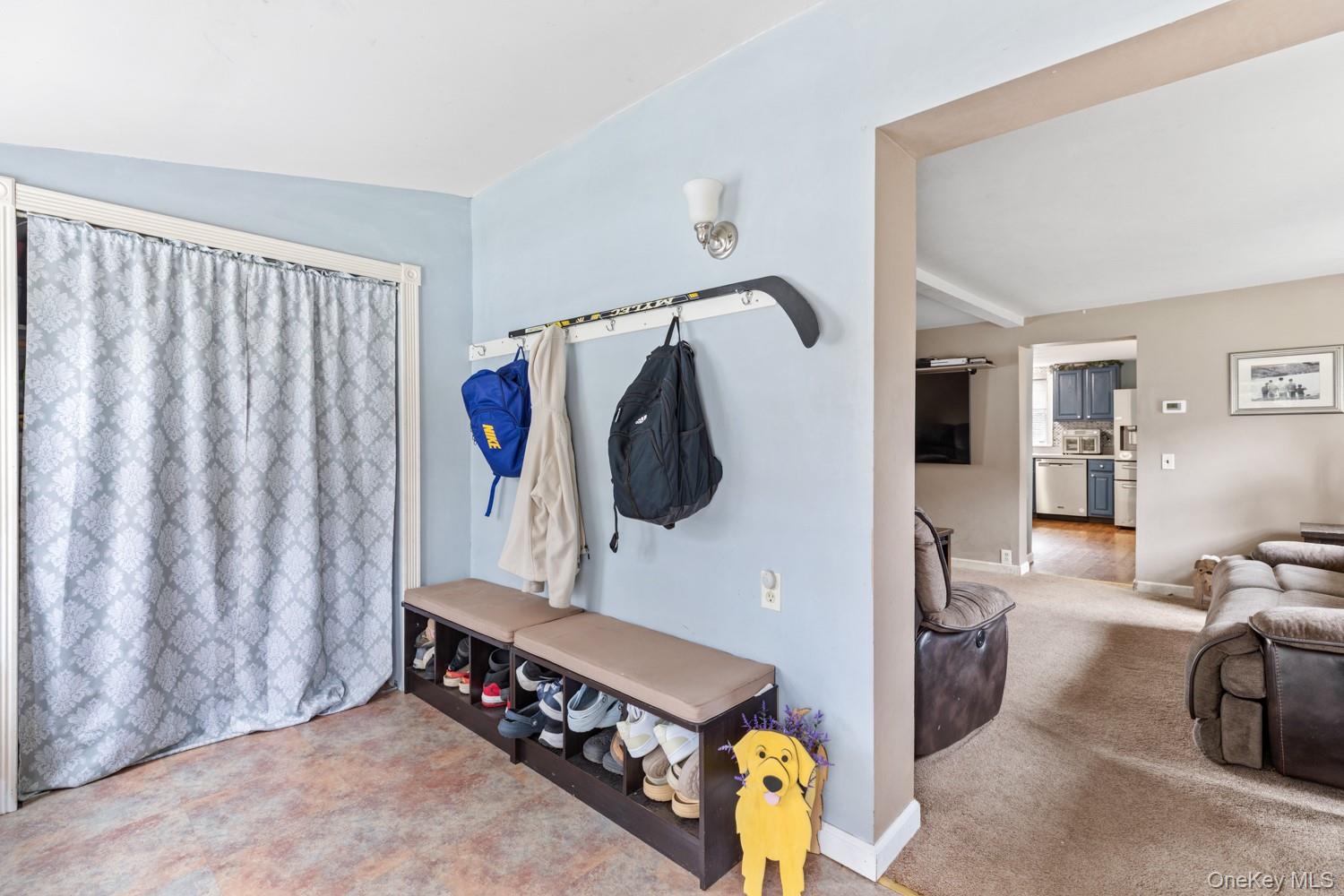 14 Comus Road Rocky Point, NY 11778 - Photo 3 of 23 a living room with furniture and a flat screen tv