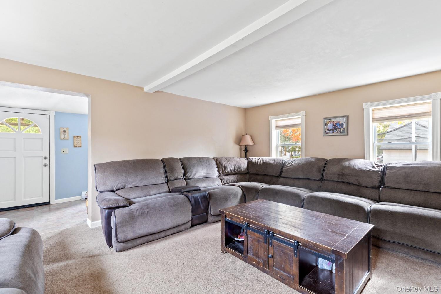 14 Comus Road Rocky Point, NY 11778 - Photo 6 of 23 a living room with furniture and a couch