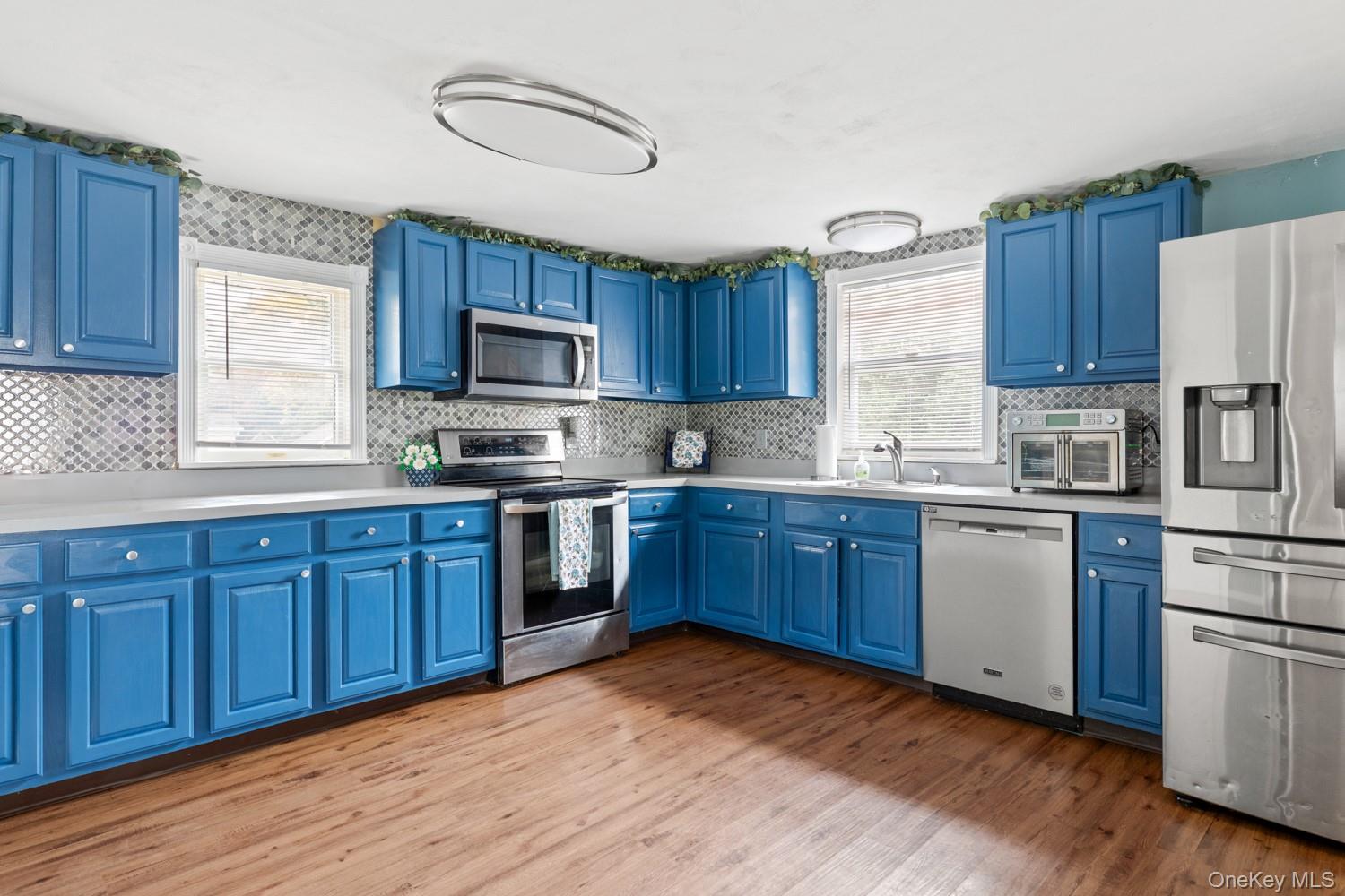 14 Comus Road Rocky Point, NY 11778 - Photo 8 of 23 a kitchen with a sink cabinets and window