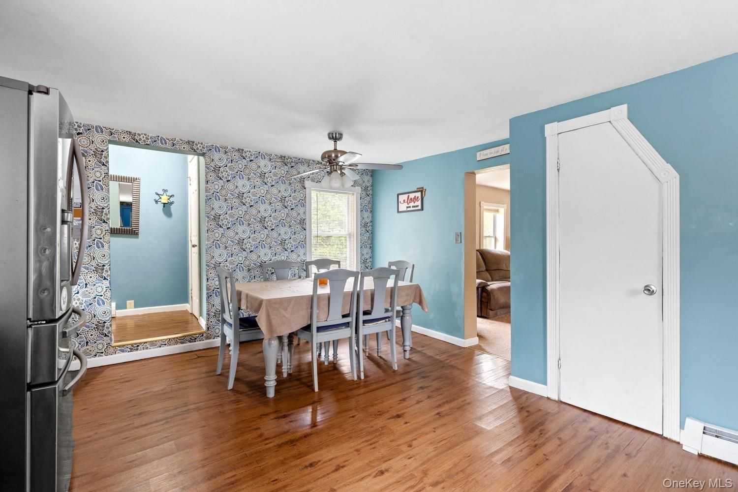 14 Comus Road Rocky Point, NY 11778 - Photo 9 of 23 a view of a dining room with furniture and wooden floor
