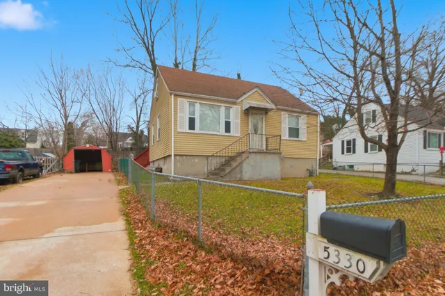a view of a house with pool and a yard