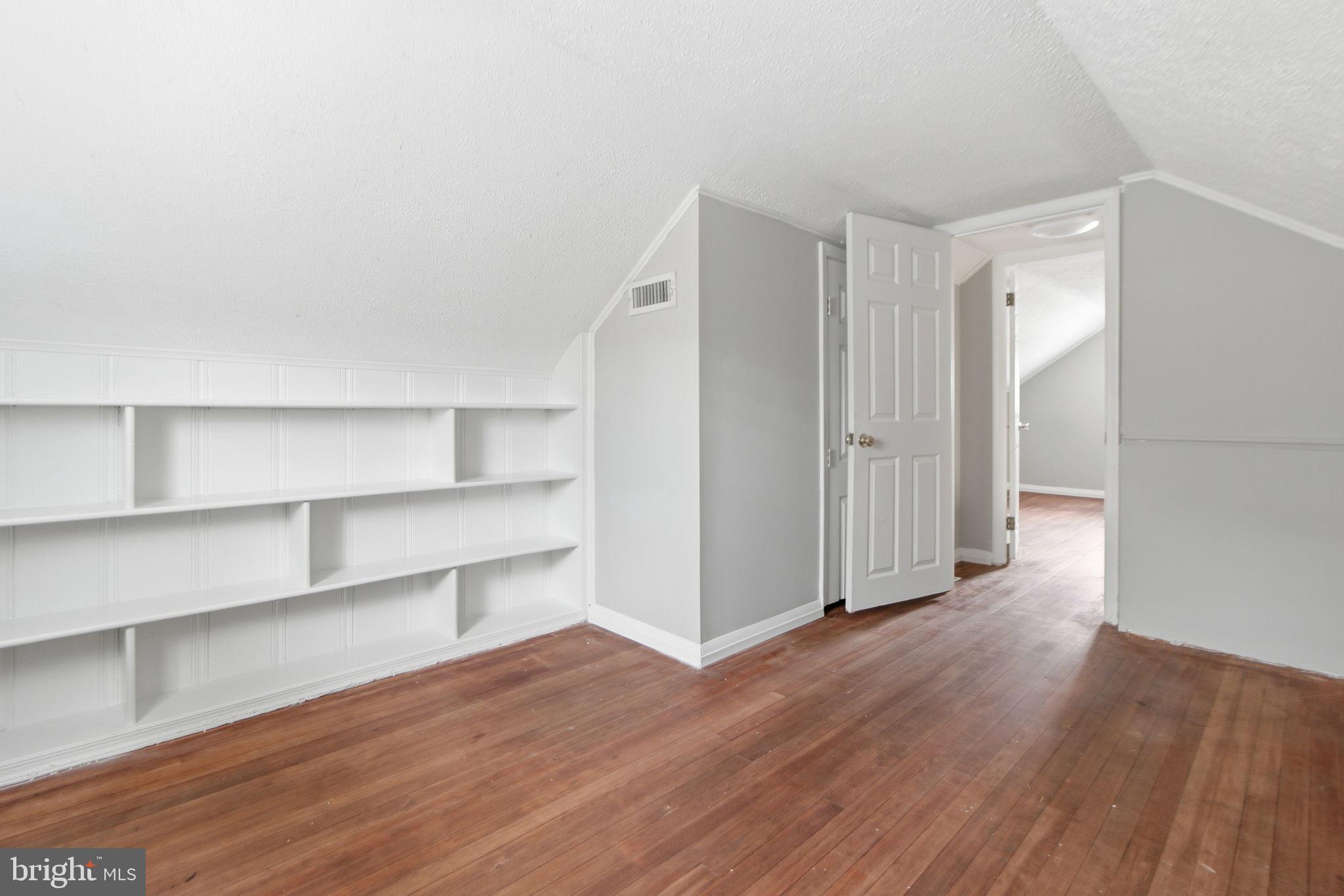 5330 Dogwood Road Woodlawn, MD 21207 - Photo 17 of 38 a view of an empty room with wooden floor and closet