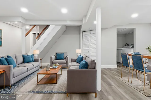 a living room with furniture and a table