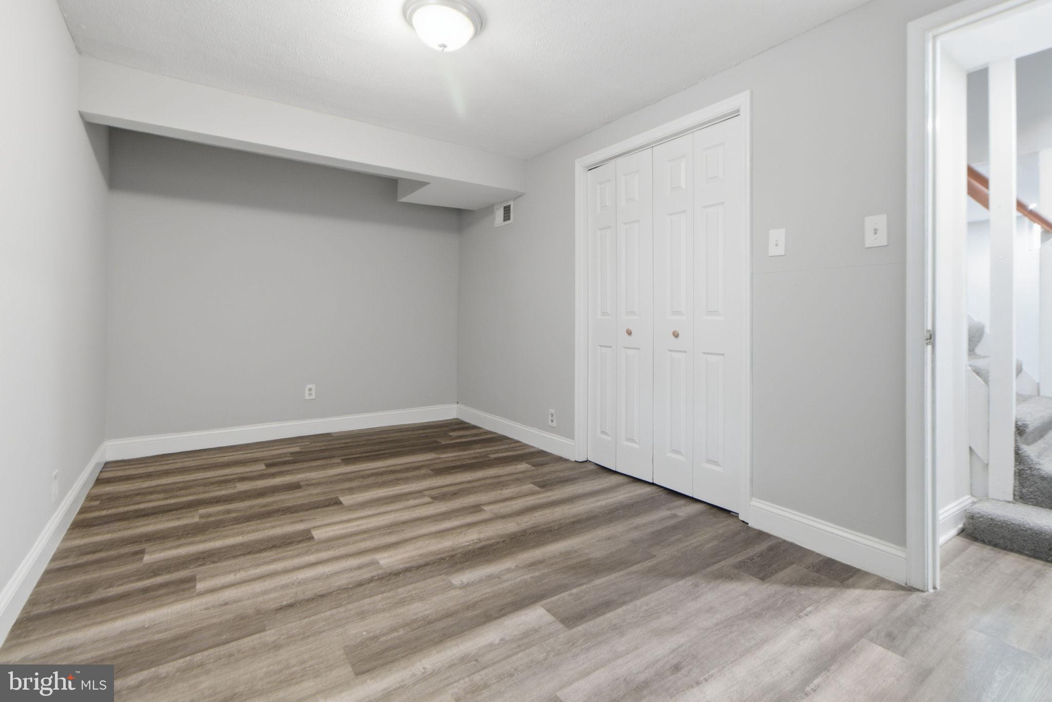 5330 Dogwood Road Woodlawn, MD 21207 - Photo 28 of 38 a view of empty room with wooden floor