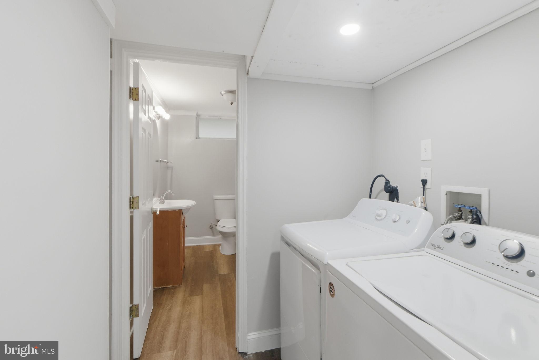 5330 Dogwood Road Woodlawn, MD 21207 - Photo 29 of 38 a utility room with dryer and washer