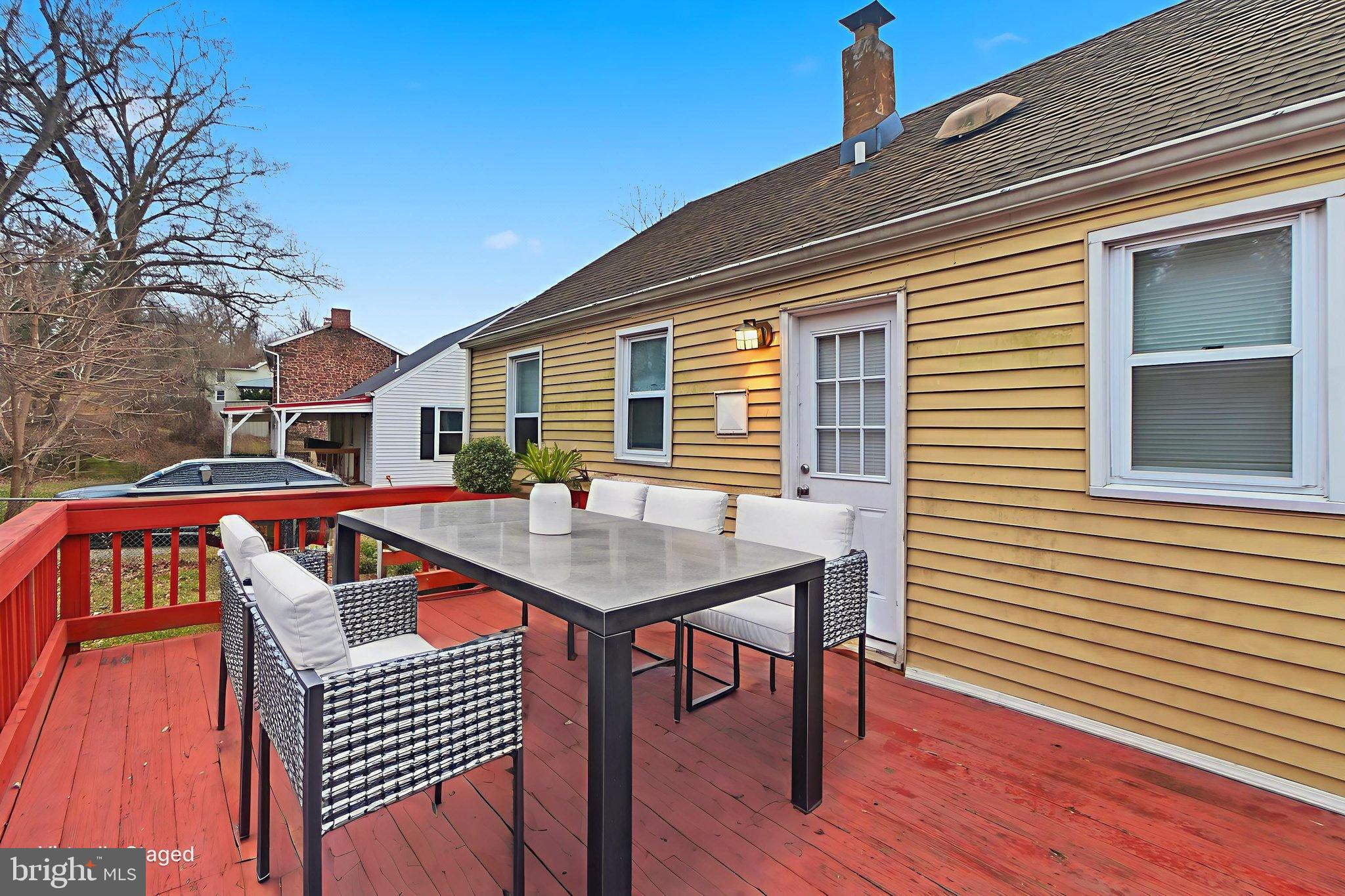 5330 Dogwood Road Woodlawn, MD 21207 - Photo 36 of 38 a front view of a house with barbeque and wooden floor