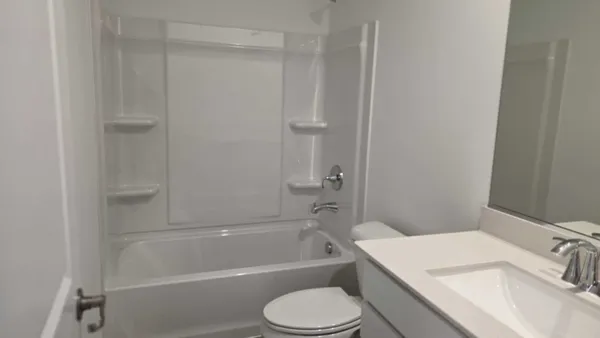 a bathroom with a sink toilet and bathtub
