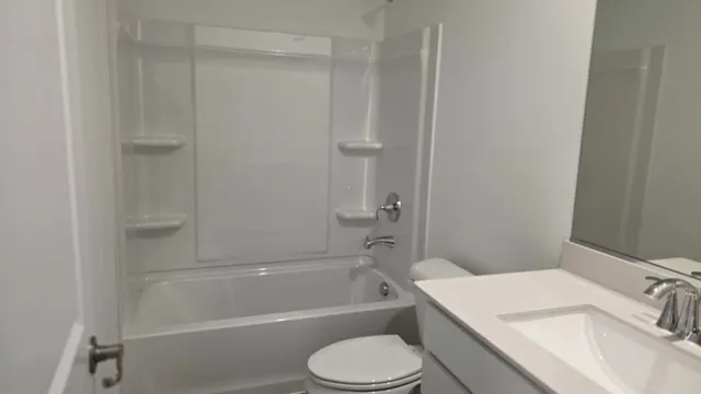 a bathroom with a sink toilet and bathtub