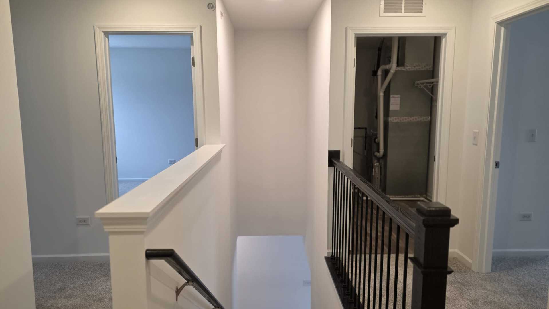 246 Cooney Way Oswego, IL 60543 - Photo 7 of 13 a view of a hallway with wooden floor and entryway