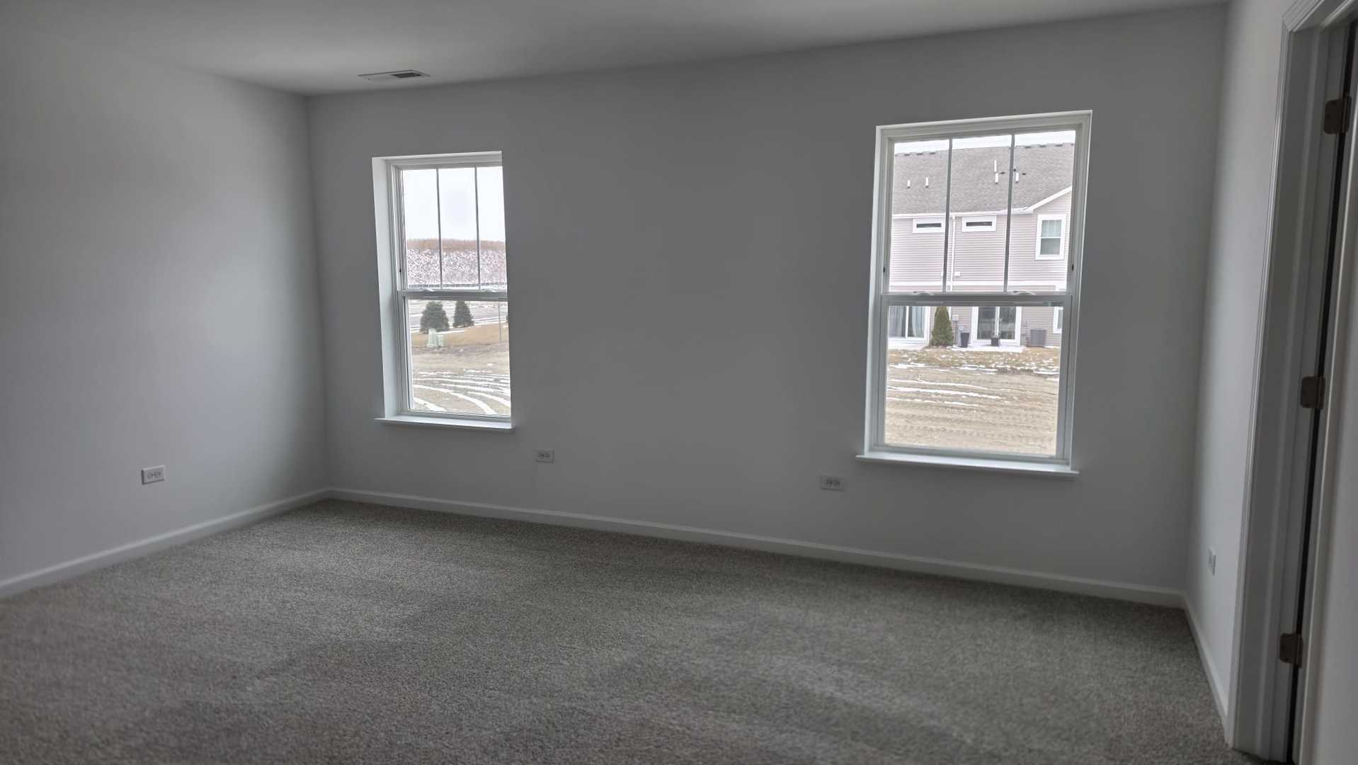 246 Cooney Way Oswego, IL 60543 - Photo 8 of 13 an empty room with a window