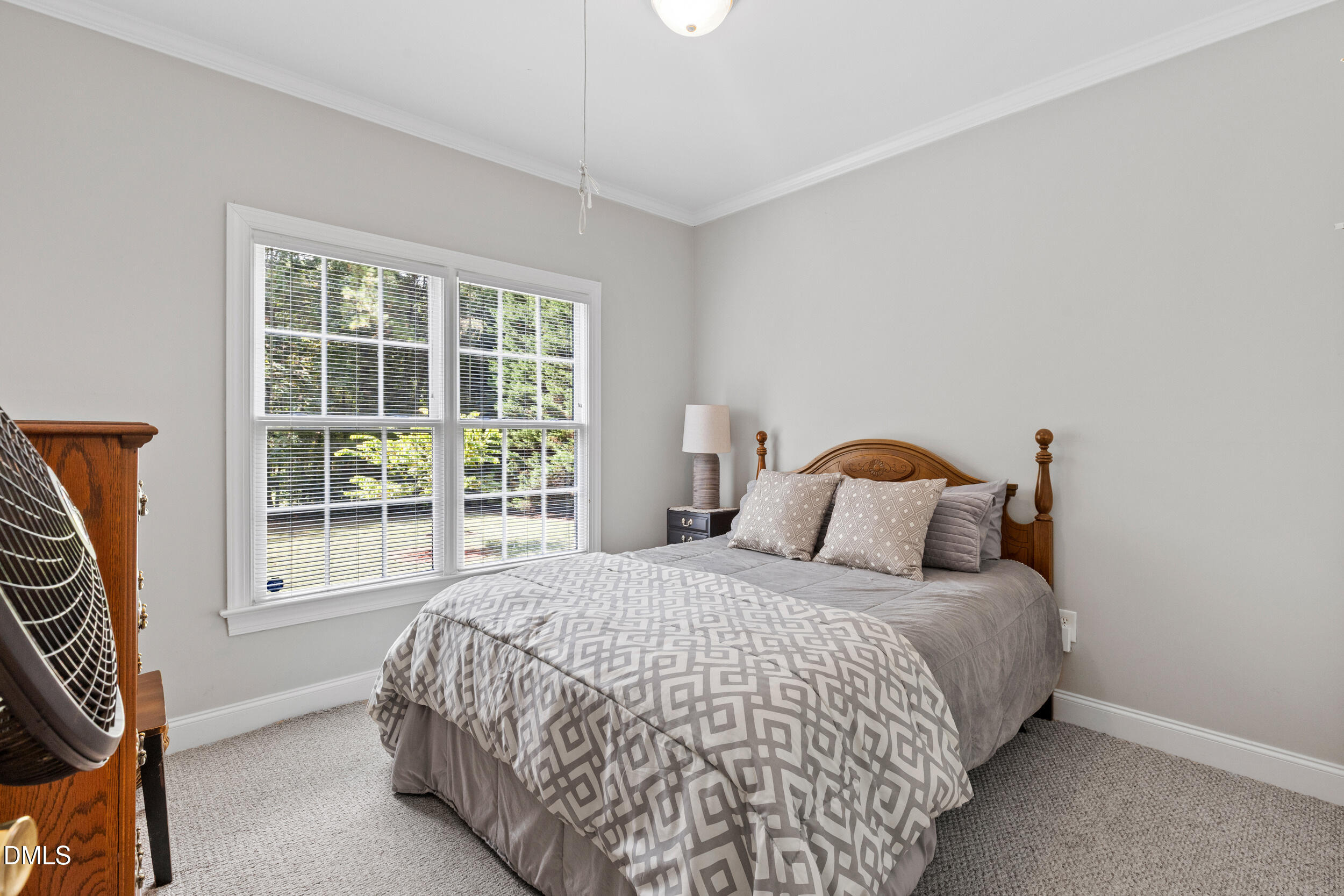 7619 Whitaker Drive Summerfield, NC 27358 - Photo 14 of 25 a bedroom with a bed and a window