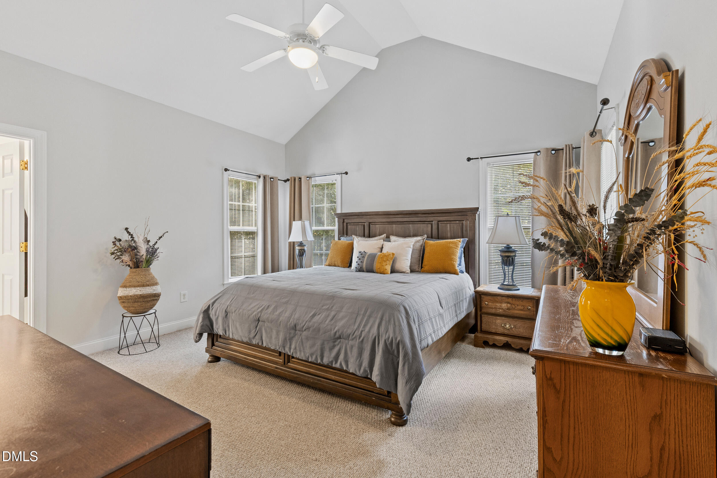 7619 Whitaker Drive Summerfield, NC 27358 - Photo 20 of 25 a bedroom with a bed and wooden floor
