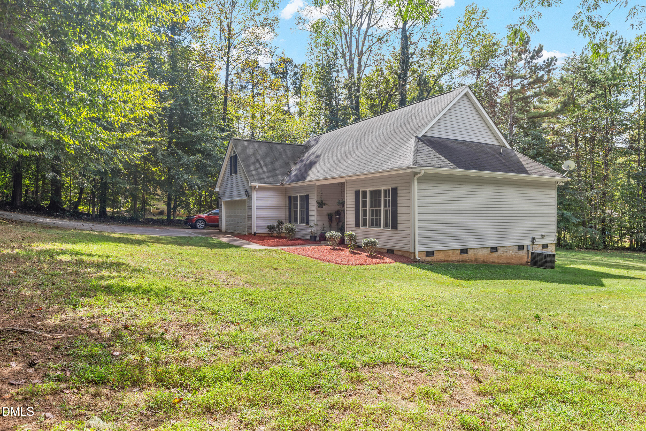 7619 Whitaker Drive Summerfield, NC 27358 - Photo 2 of 25 a front view of house with yard and seating area